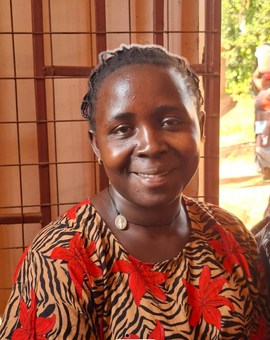 Portrait of Babra, a Busia market trader supplying bananas to the Burlcore Foundation welfare programme