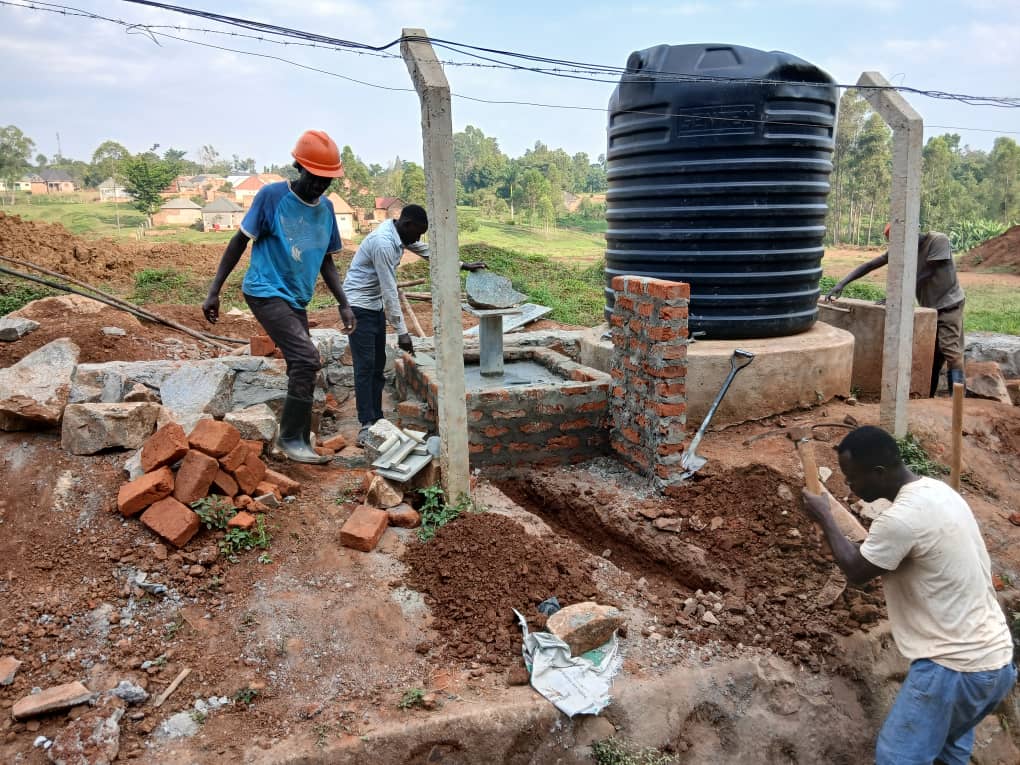Installing the elevated storage tank at the Mawero water project